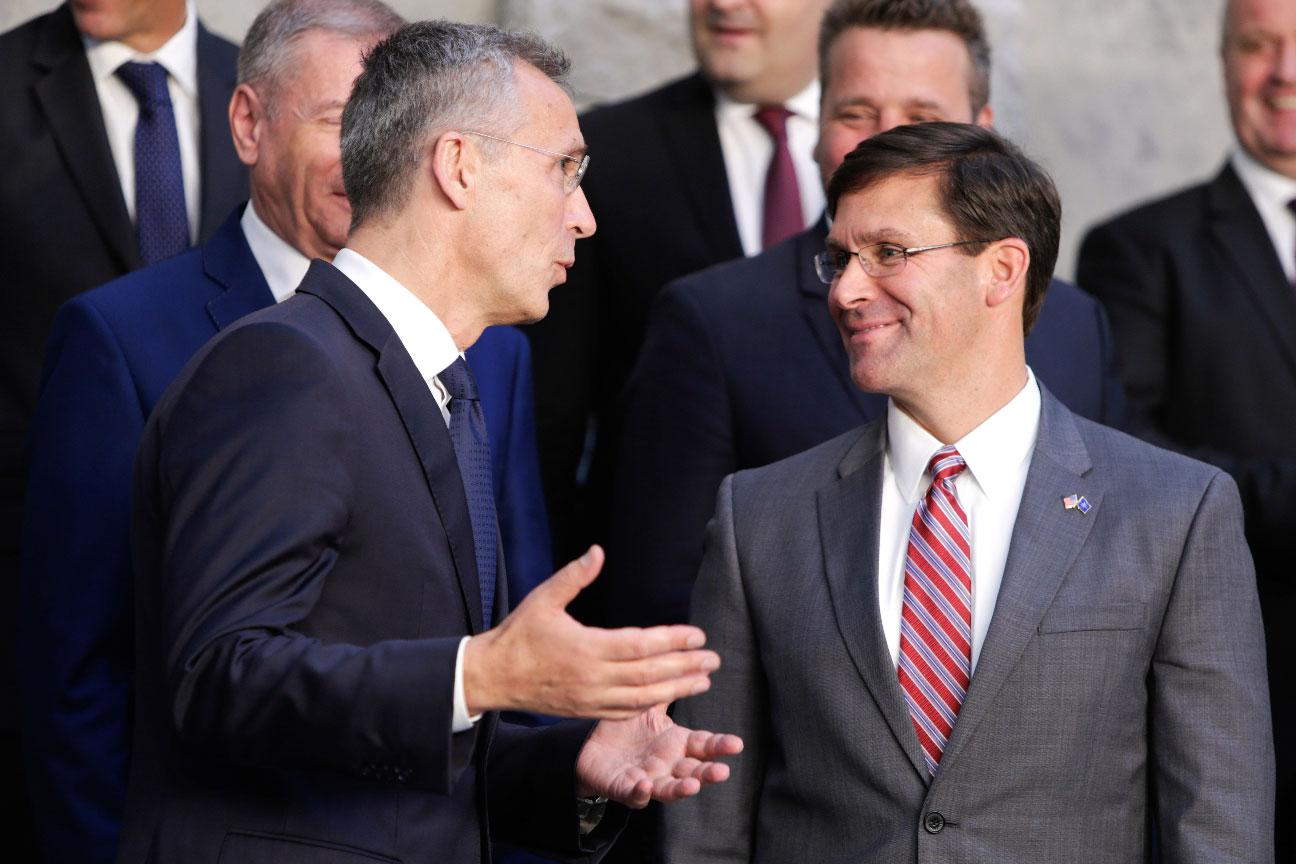 NATO Secretary General Jens Stoltenberg (L) speaks with acting US Secretary for Defense Mark Esper
