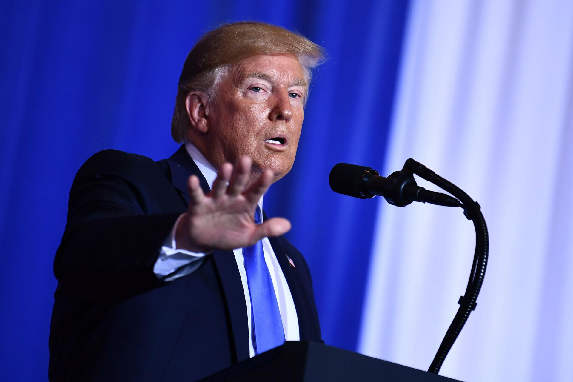 US President Donald Trump gestures during a press conference on the sidelines of the G20 Summit in Osaka