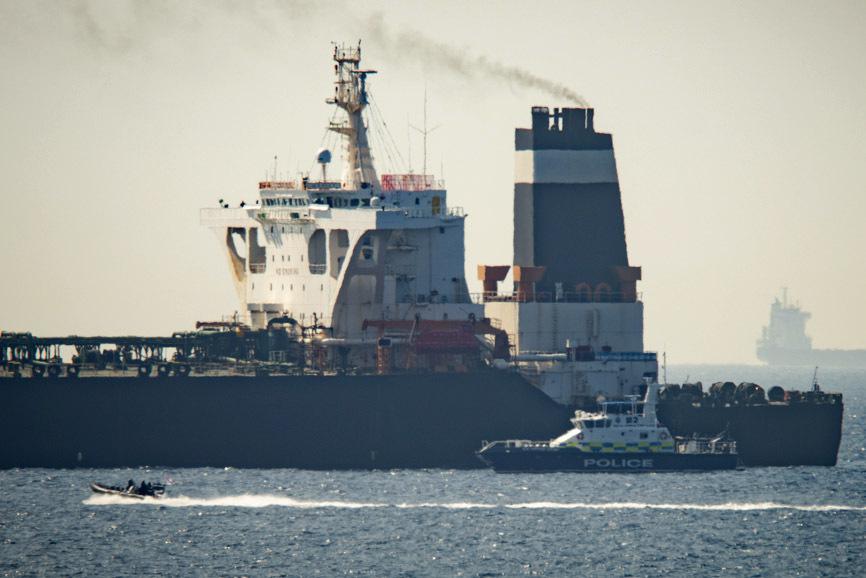 Royal Marine patrol vessel is seen beside the Grace 1 super tanker in the British territory of Gibraltar