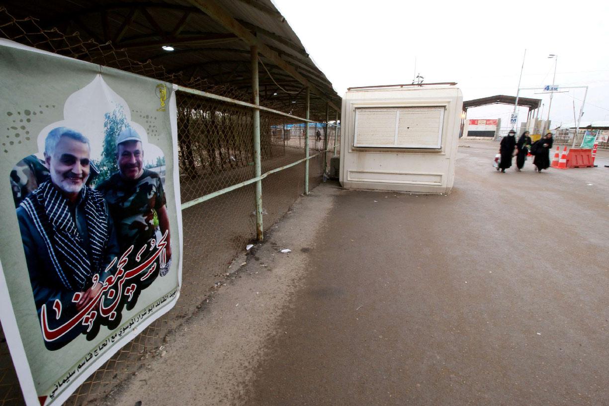 Poster featuring Iranian commander Qassem Soleimani is seen at the Iran-Iraq border
