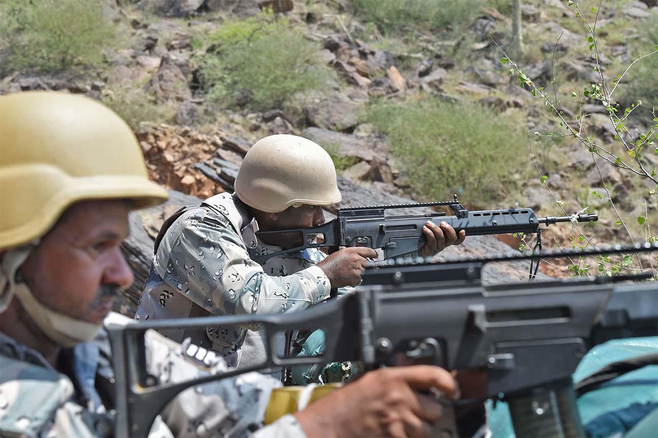 Saudi border guards keep watch along the border with Yemen in the al-Khubah area in the southern Jizan province