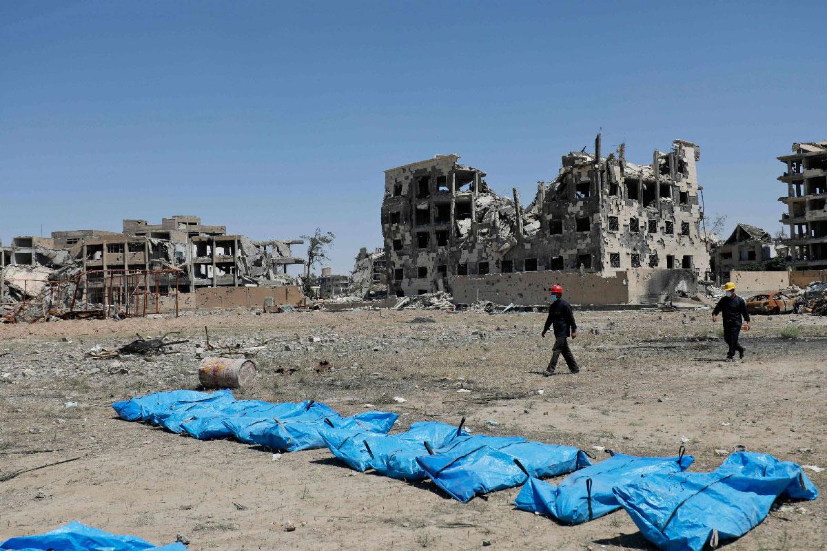 Photo taken on April 23, 2018 shows bodies that have been found in a mass grave in the former Islamic State group stronghold of Raqa in Syria