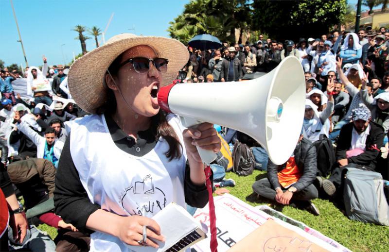 Young teachers take part in a protest demanding their integration in the civil service as employees of the education ministry in Rabat