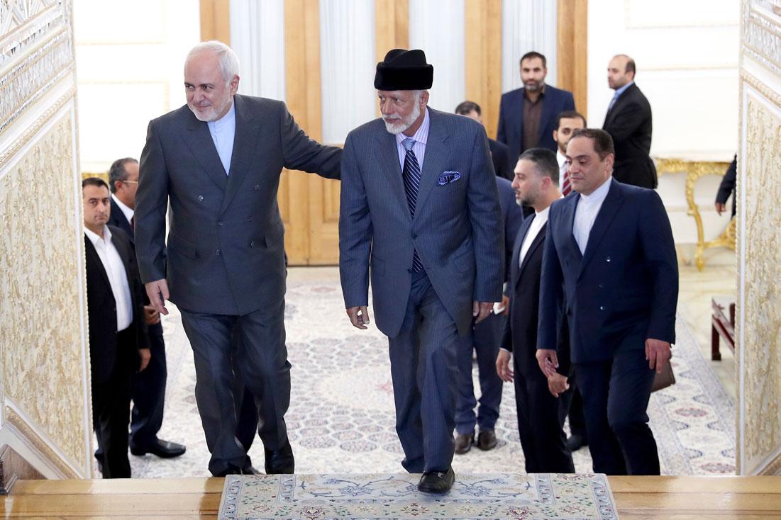 Iranian Foreign Minister Mohammad Javad Zarif, left, welcomes his Omani counterpart Yousuf bin Alawi