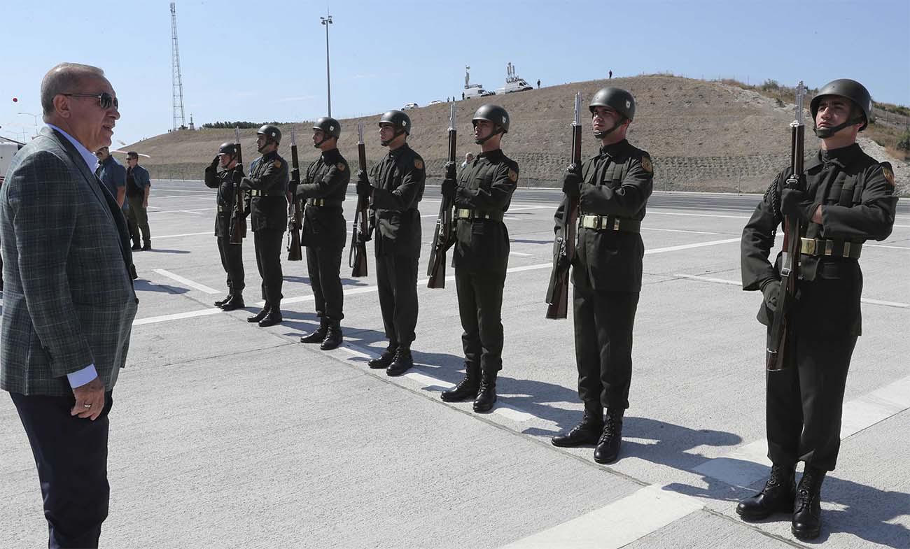 Erdogan inspects a military honour guard before addressing his supporters in Bursa, Turkey