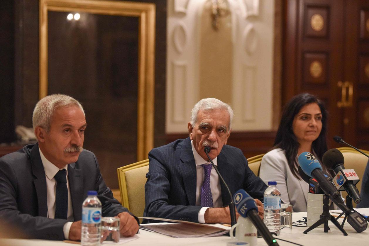 The removed mayor of Mardin Ahmet Turk (C) speaks during a foreign media conference along side the removed mayor of Diyarbakir Adnan Selcuk Mizrakli (L) and the removed Kurdish mayor of Van Bedia Ozgokce Ertan (R)