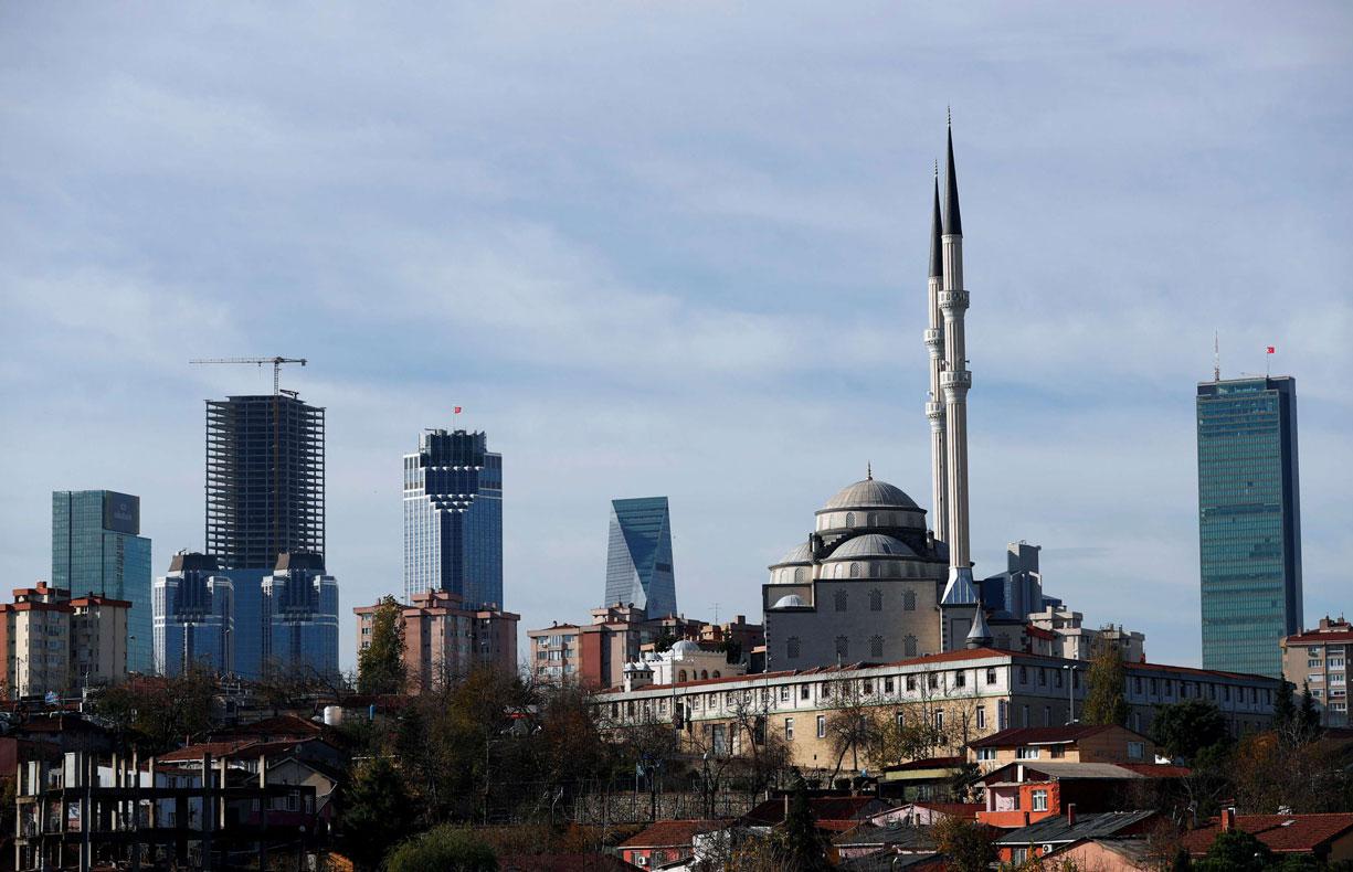  Business and financial district of Levent, which comprises of leading Turkish banks' and companies' headquarters, is seen behind a residential neighborhood in Istanbul