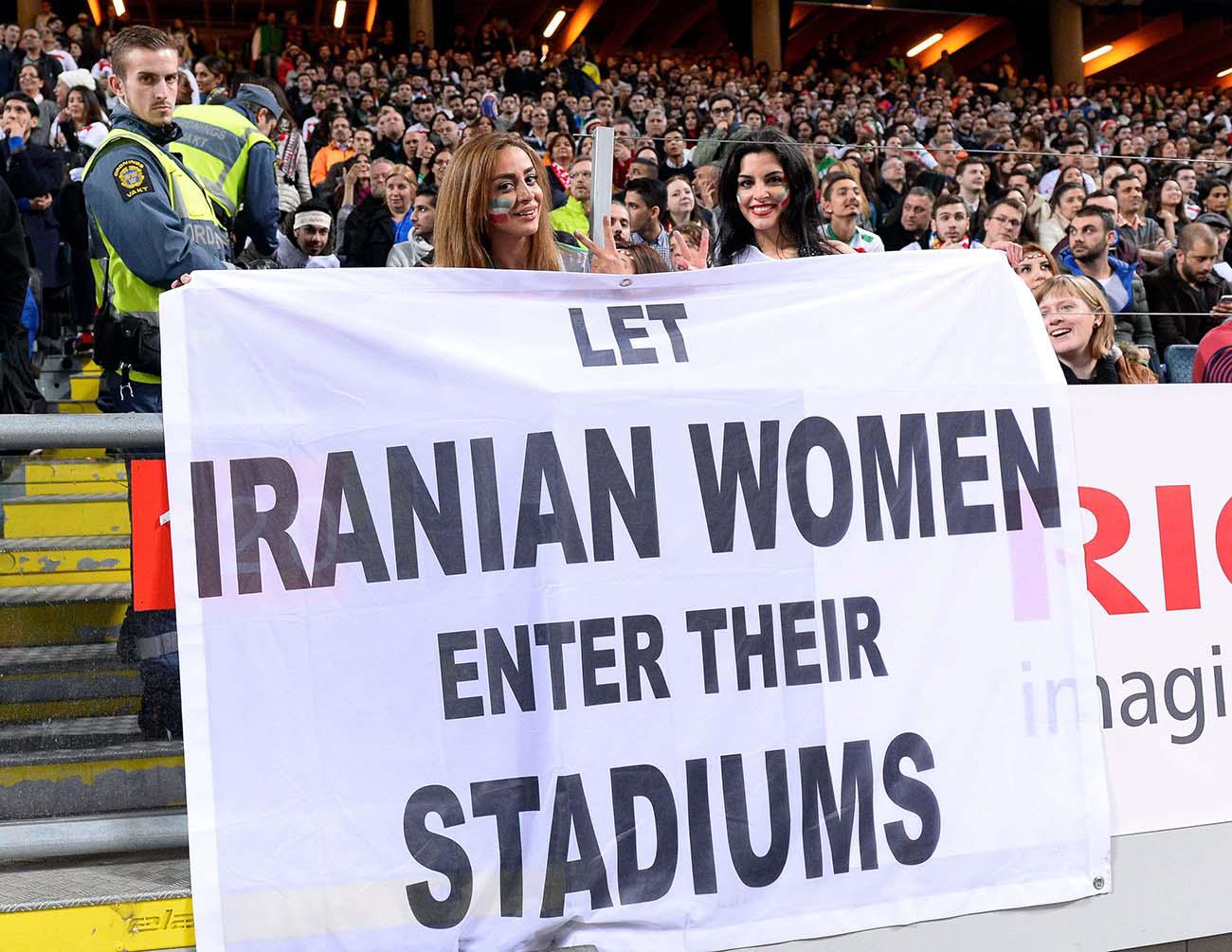 'Let Iranian women enter their stadiums', reads the banner