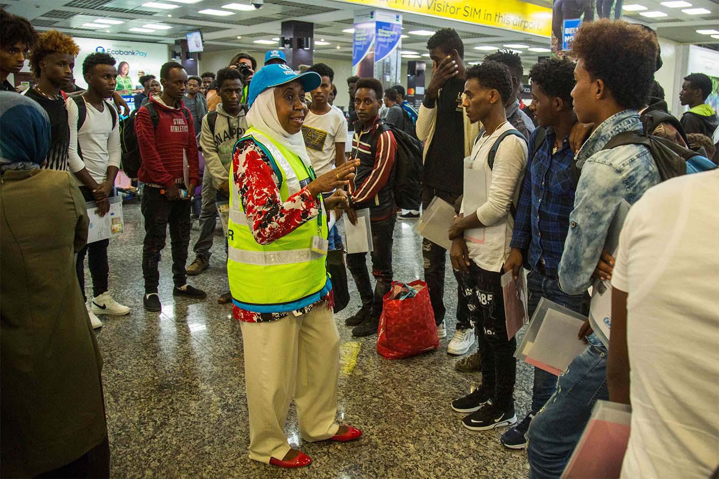 Rwanda's UNHCR welcoming the first arrival of 66 refugees and asylum seekers from Libya at the Kigali international airport