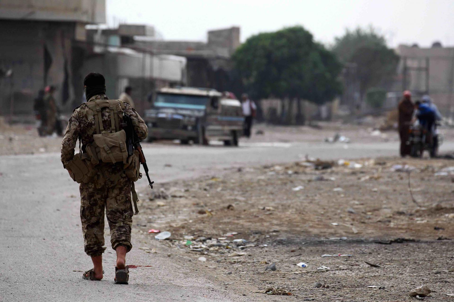 Dozens of fighters in military attire left on pickups, passing by checkpoints manned by Ankara-allied Syrian fighters, the reporter said.