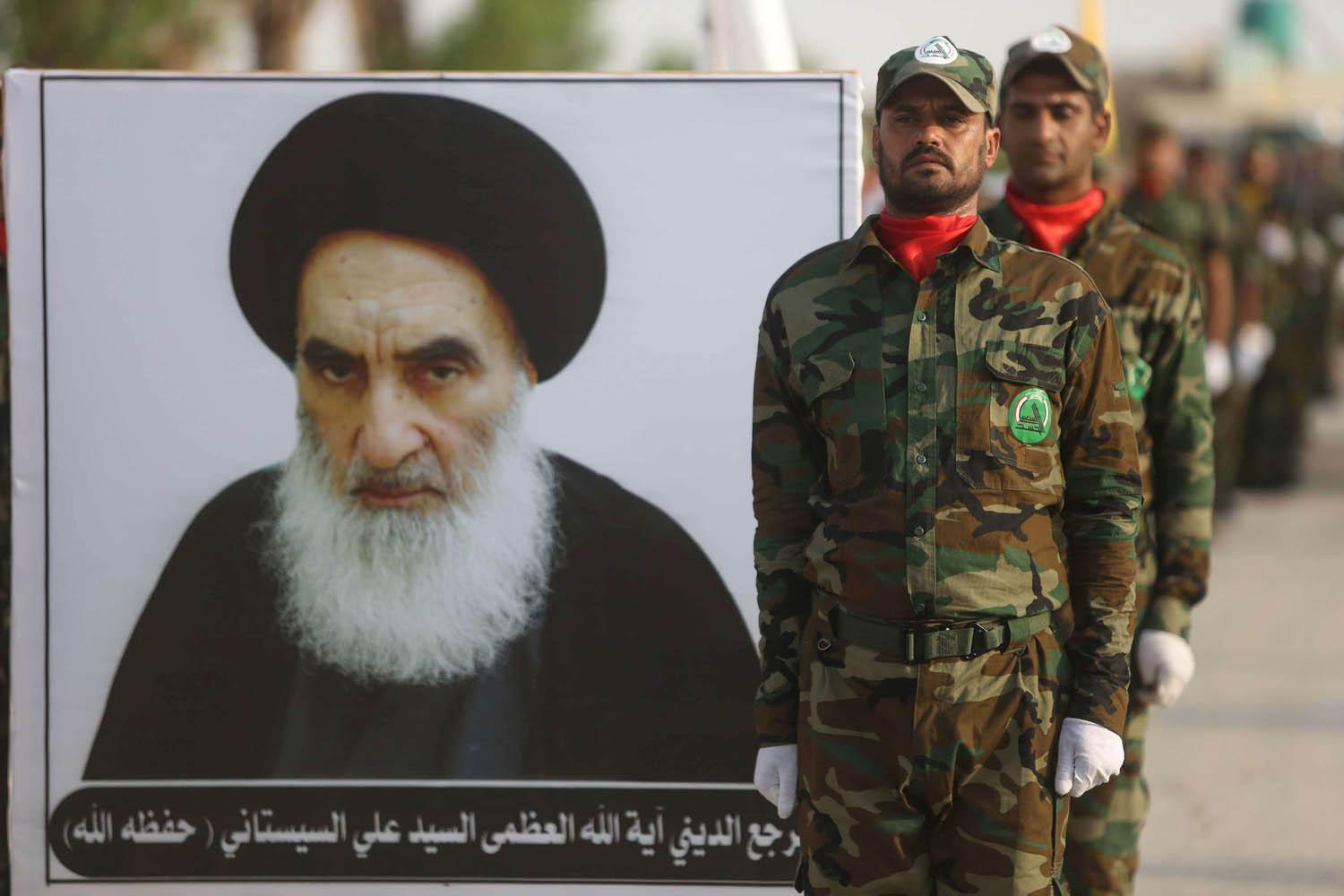 قوات من الحشد الشعبي تستعرض وسط بغداد