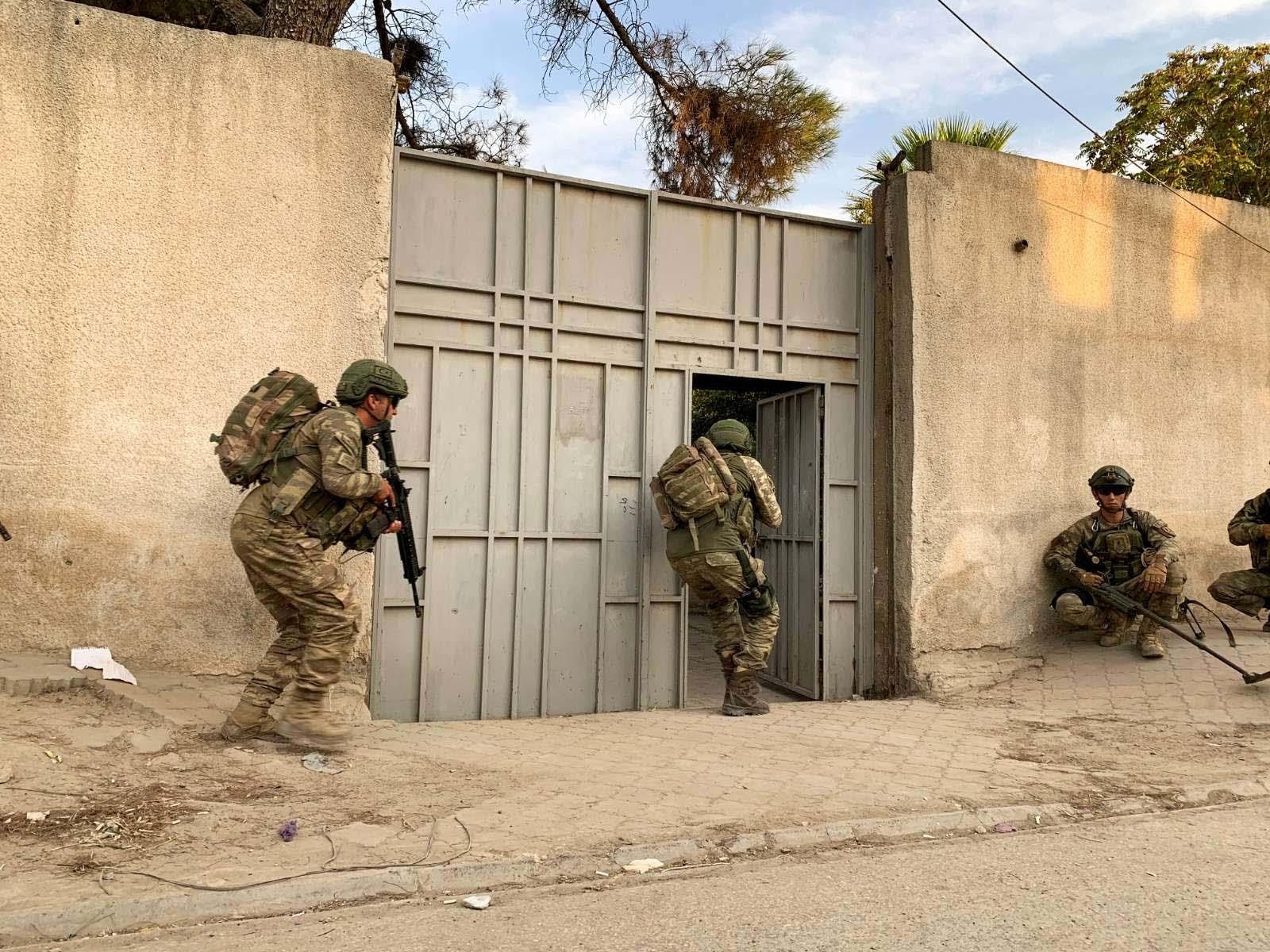 Turkish soldiers are seen in the border town of Tal Abyad, Syria