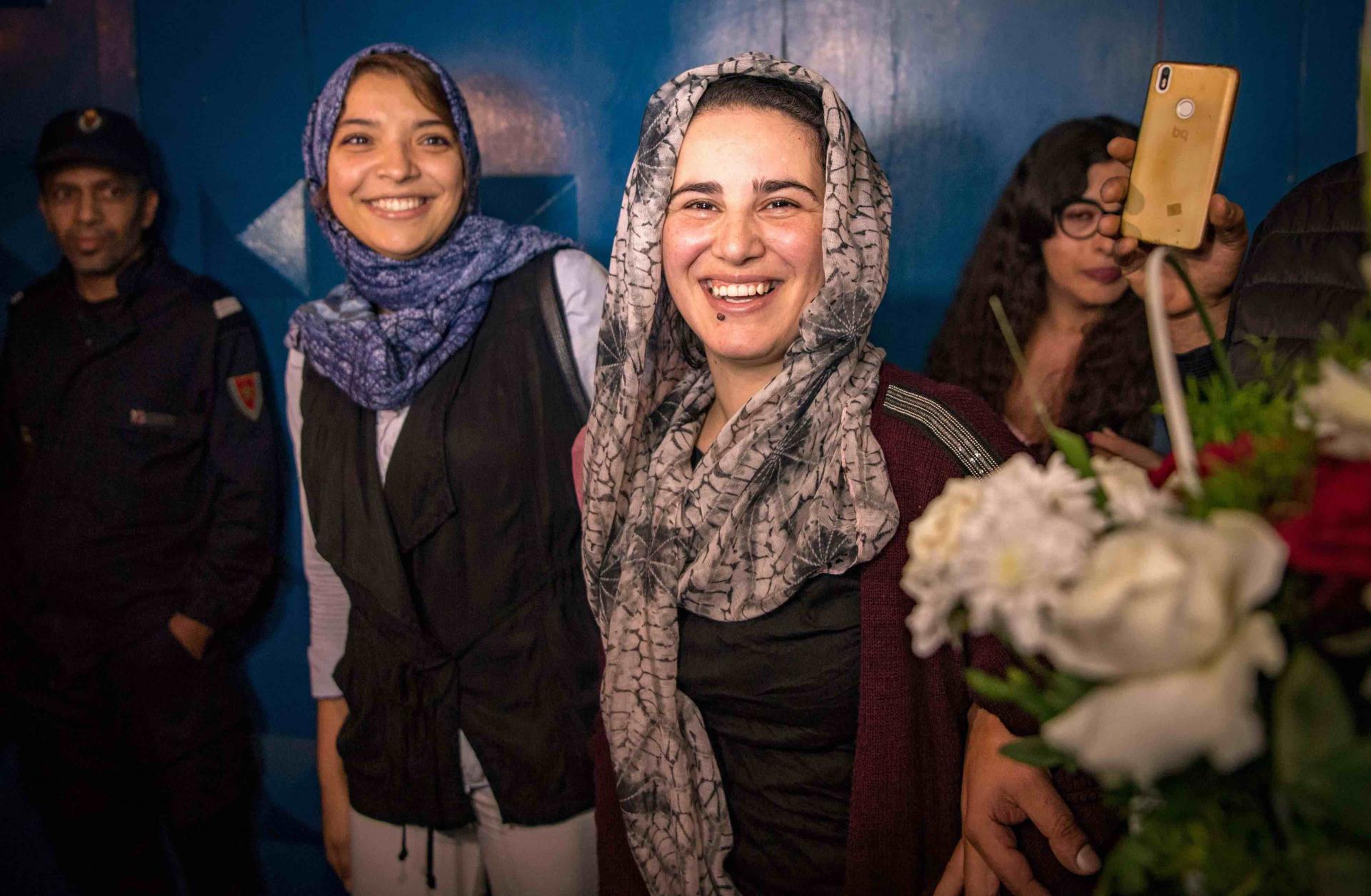 Moroccan journalist Hajar Raissouni (R) is greeted after leaving a prison in Sale near Rabat