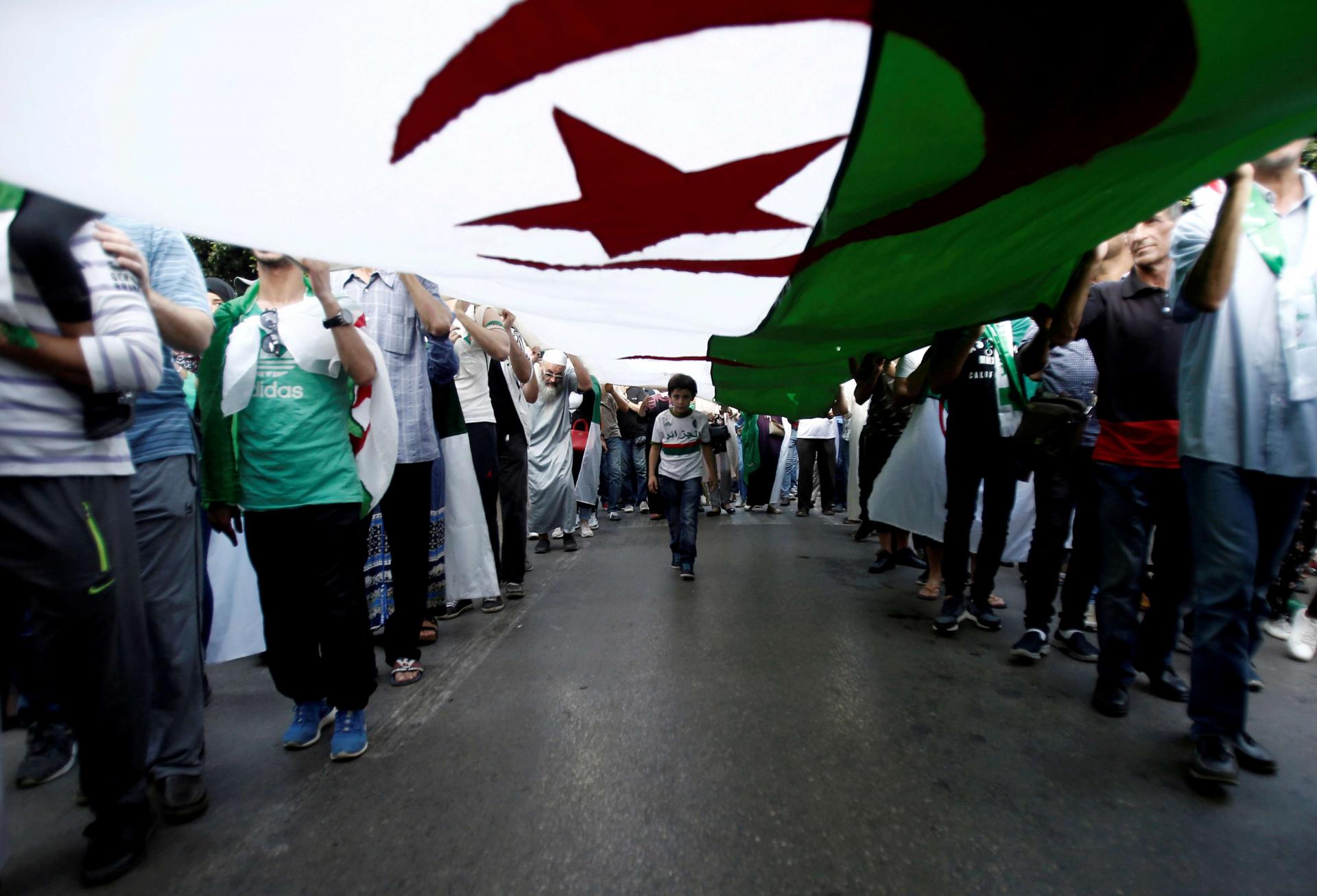 Protesters oppose the election to replace Bouteflika, saying it cannot be fair so long as his allies retain positions of power 