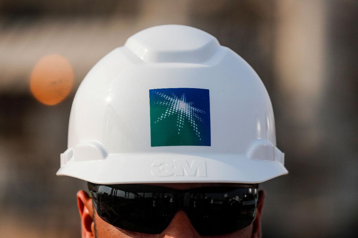 An employee in a branded helmet is pictured at Saudi Aramco oil facility in Abqaiq