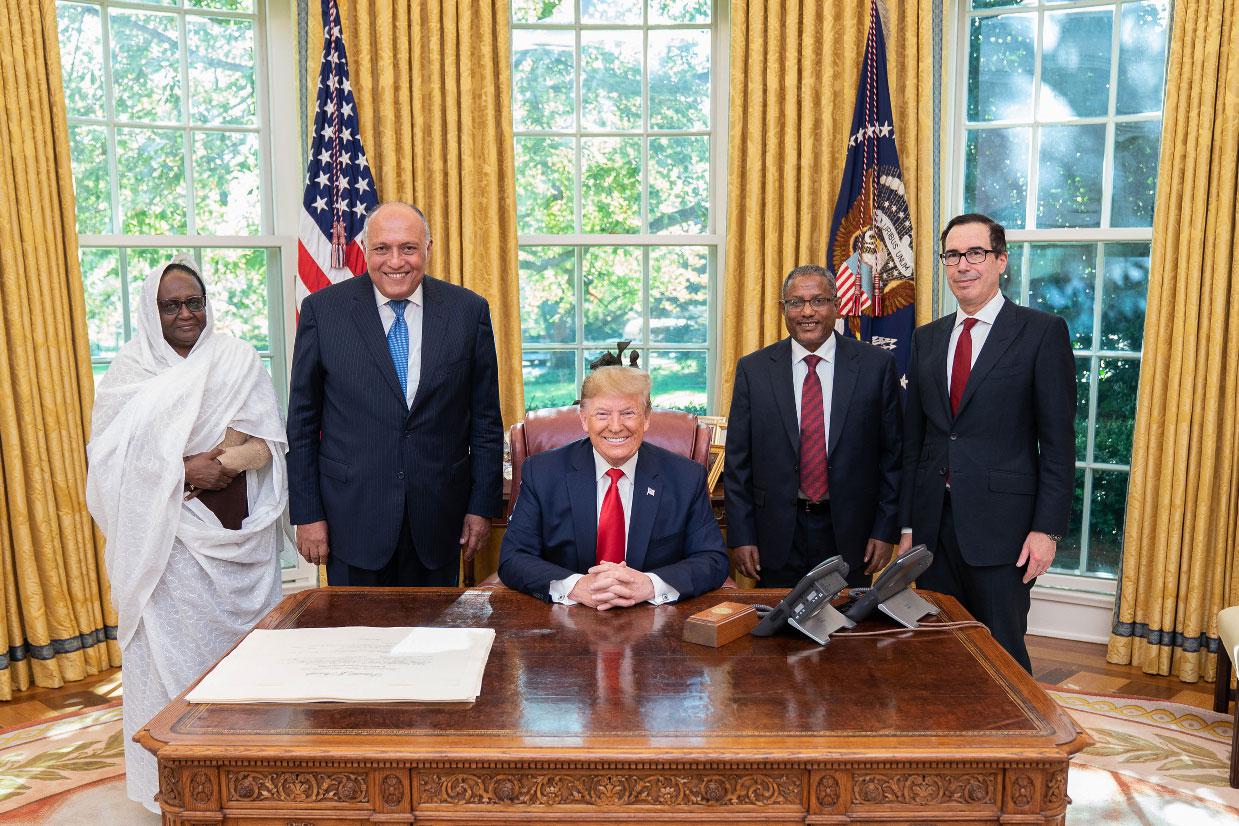 US President Donald Trump (C) poses for a picture with Sudanese Minister of Foreign Affairs Asma Mohamed Abdalla (L), Egyptian Minister of Foreign Affairs Sameh Shoukry (2nd L), Ethiopian Minister of Foreign Affairs Gedu Andargachew (2nd R), and US Secretary of the Treasury Steven Mnuchin (R)