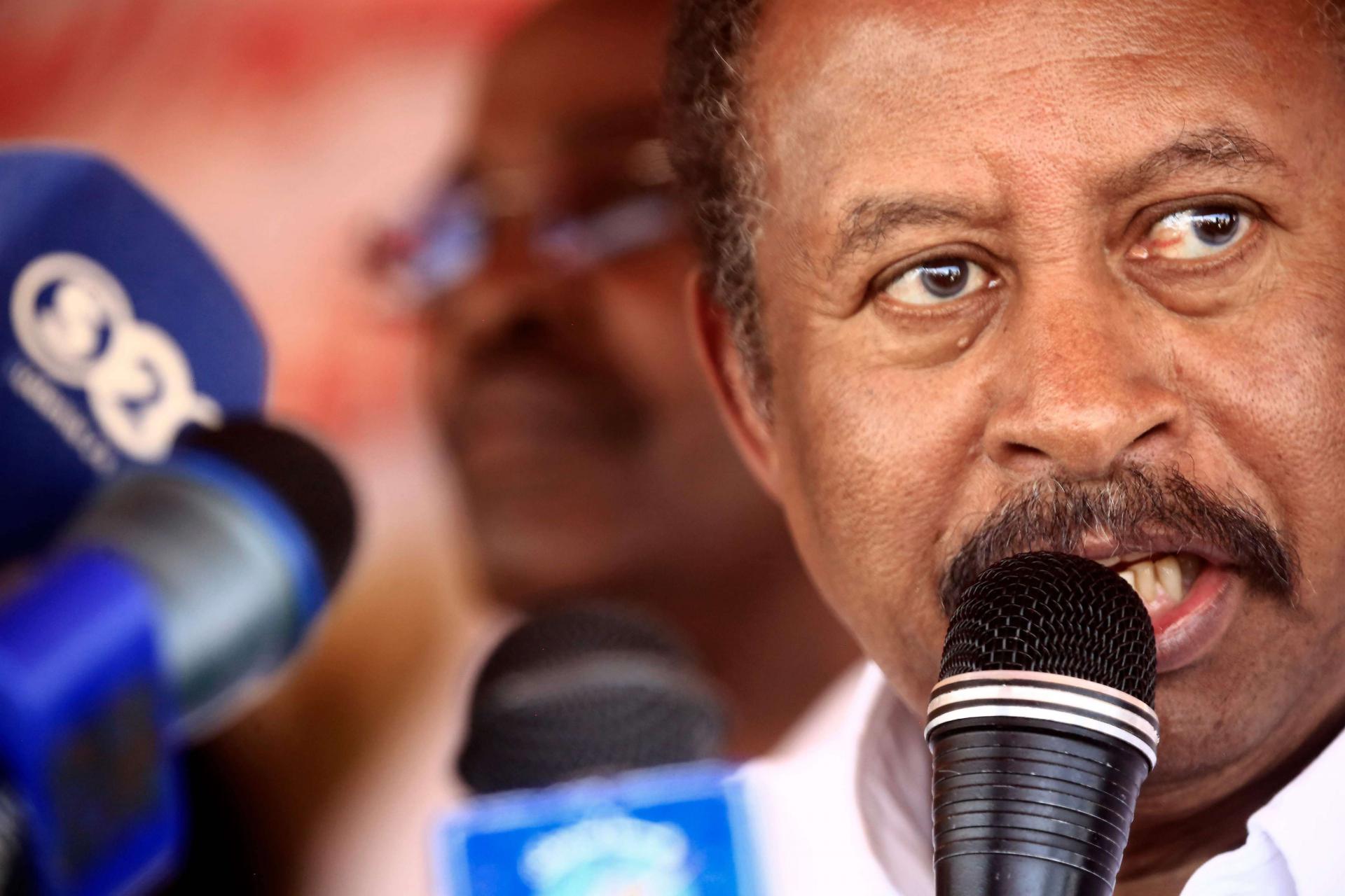 Sudan's prime minister Abdalla Hamdok speaks during a visit to a camp for internally displaced people (IDP) in El-Fasher, the capital of the North Darfur state