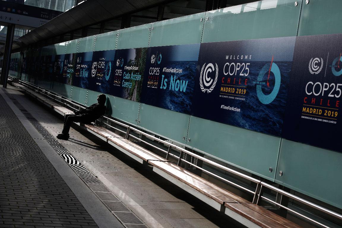 A man sits at the COP25 climate talks congress in Madrid