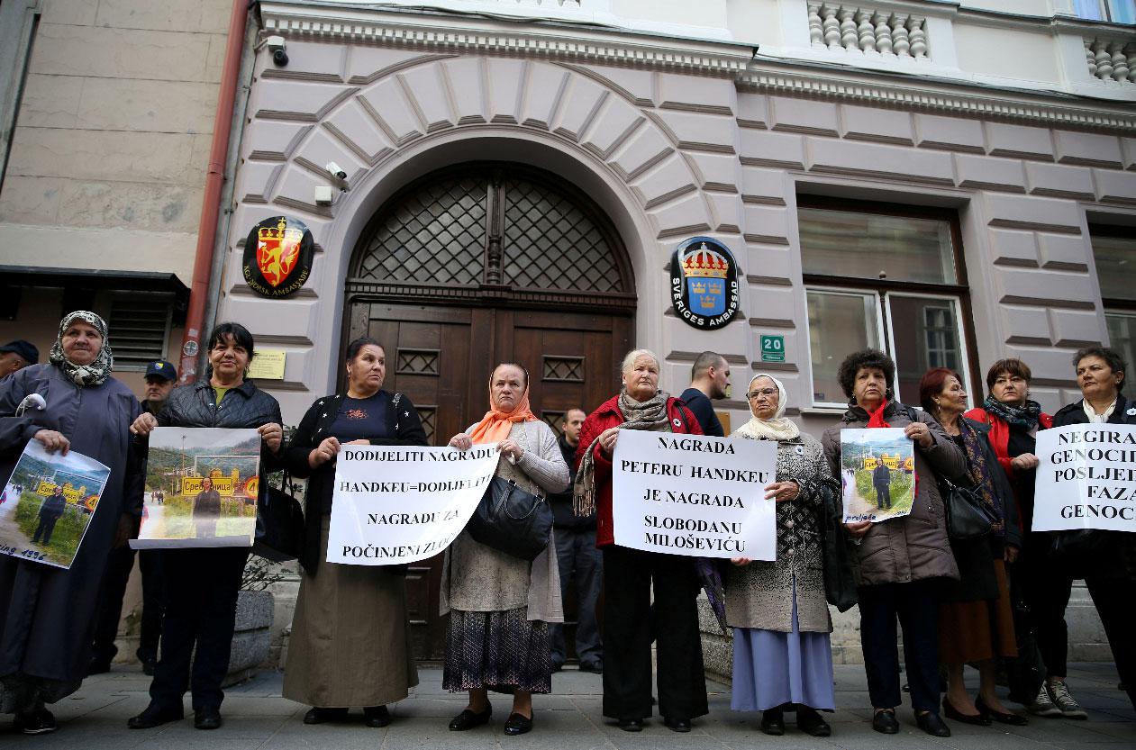Representatives of the Association of Victims and Witnesses of Genocide hold a picture of the winner of the 2019 Nobel Prize for Literature Peter Handke in Srebrenica, during a protest in front of Sweden embassy in Sarajevo, Bosnia and Herzegovina