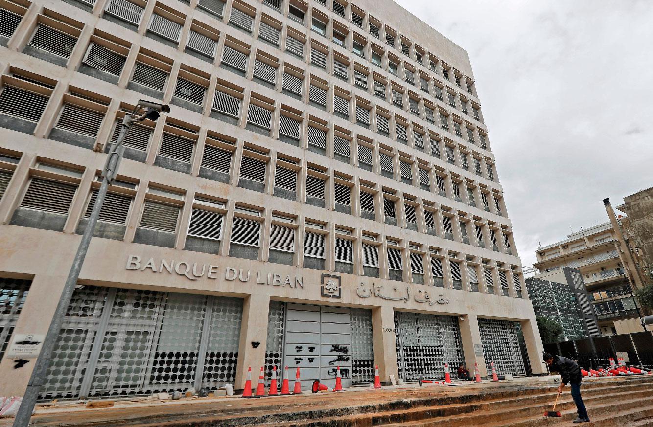 Workers carry out renovation outside the headquarters of the Lebanese Central Bank in Beirut