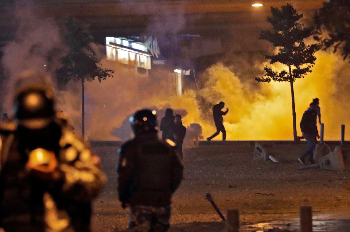 Supporters of Lebanon's Shiite Hezbollah and Amal groups clash with security forces