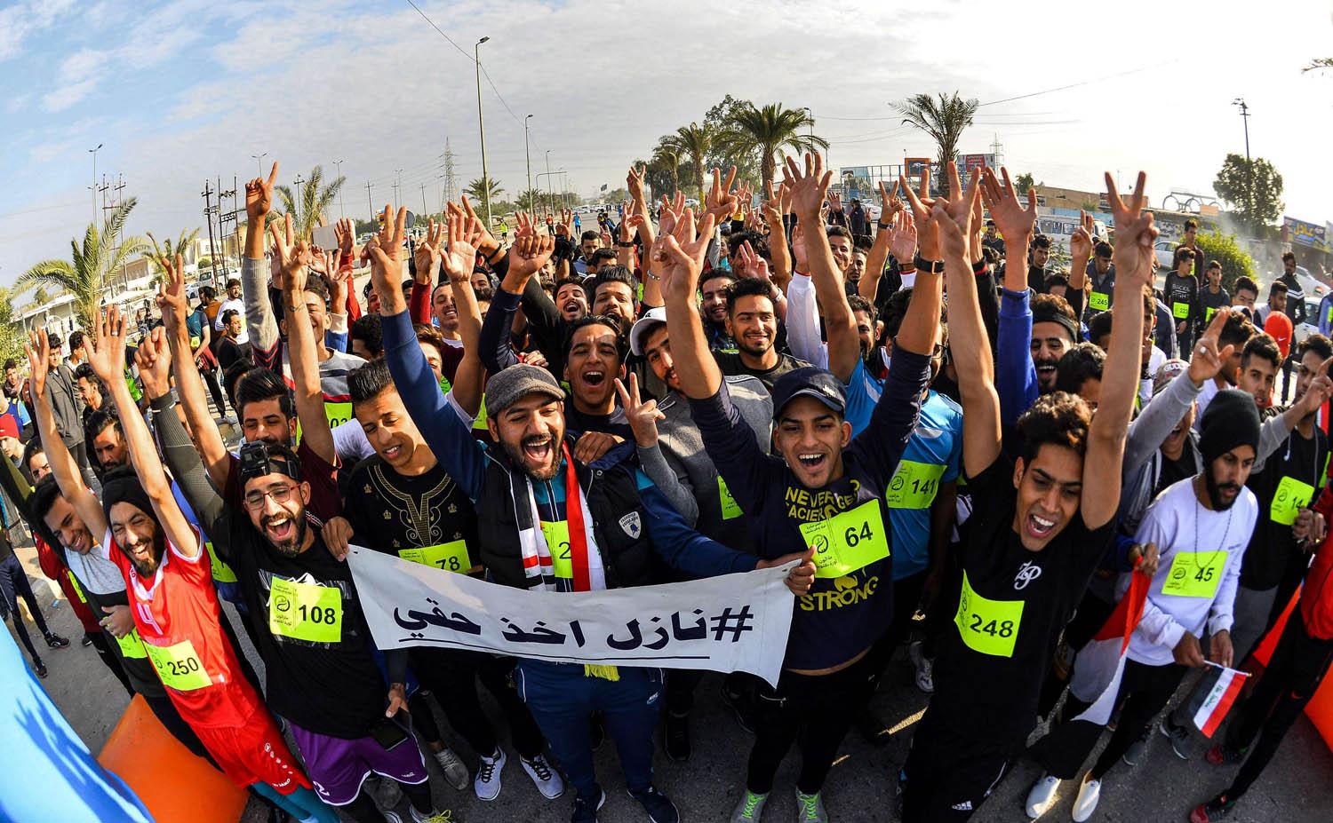 طلبة جامعة الكوفة ينظمون ماراثون احتجاجيا