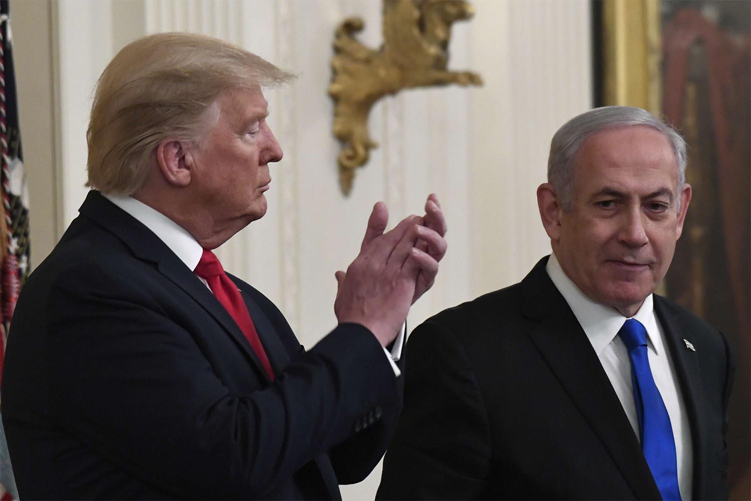 US President Donald Trump listens to Israeli Prime Minister Benjamin Netanyahu