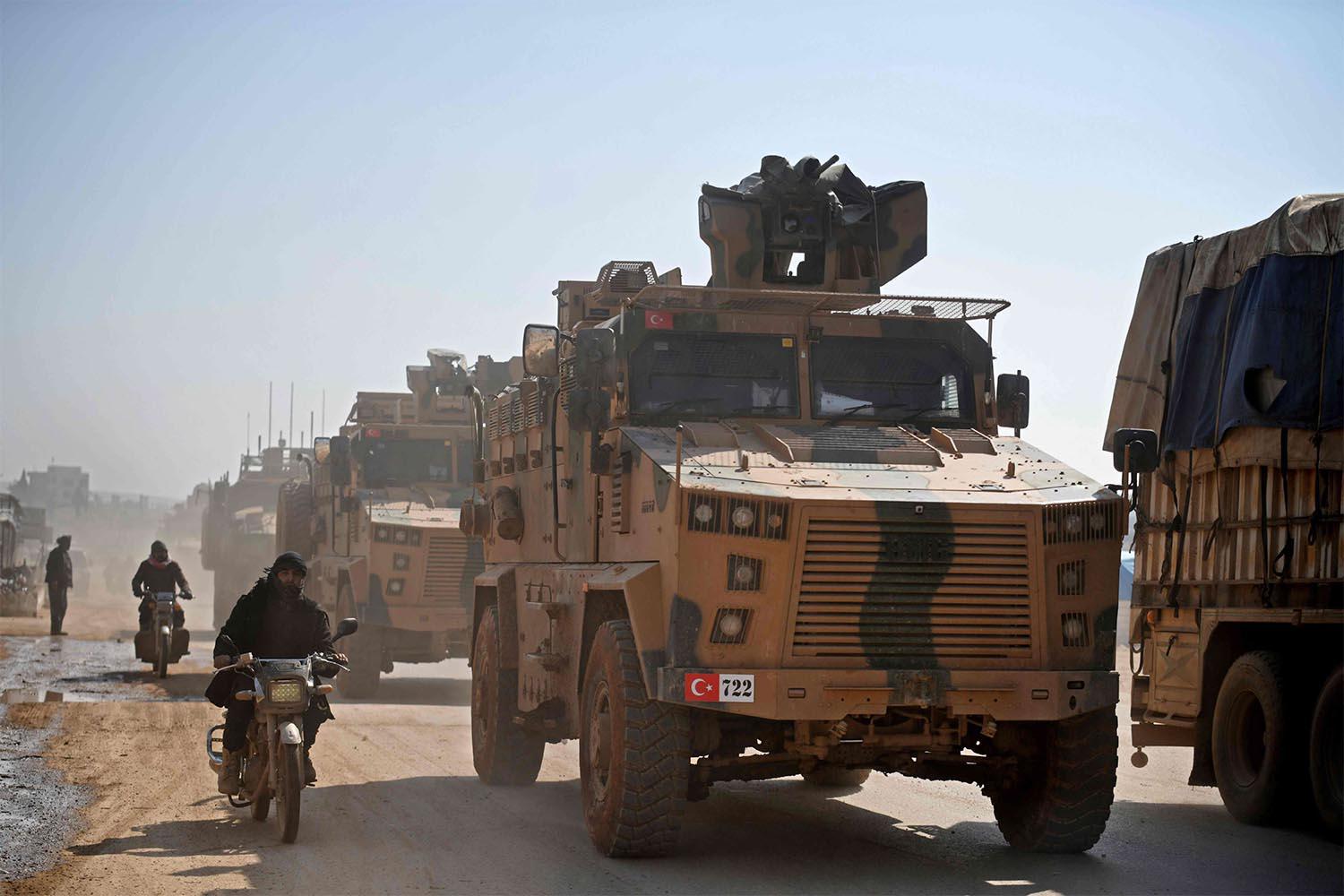 A Turkish military convoy heading from the Syrian town of Sarmada towards the Bab Al-Hawa crossing with Turkey 