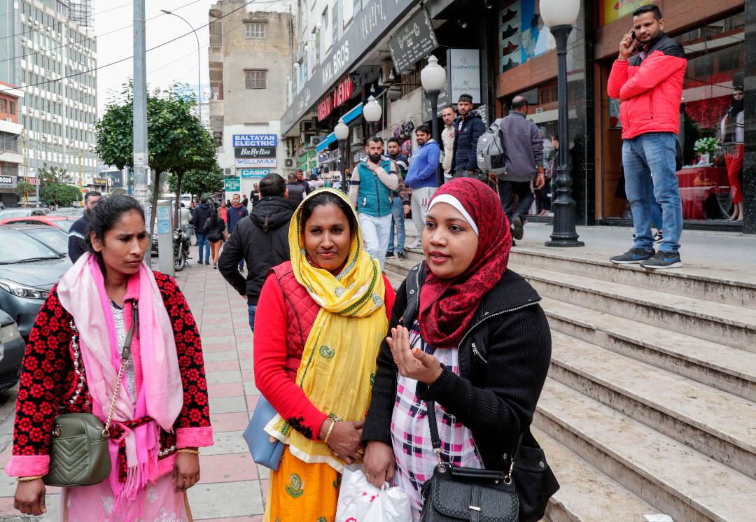 Djasmie Begon (R), a 32-year-old domestic worker from Bangladesh is pictured during an interview in the Lebanese capital Beirut