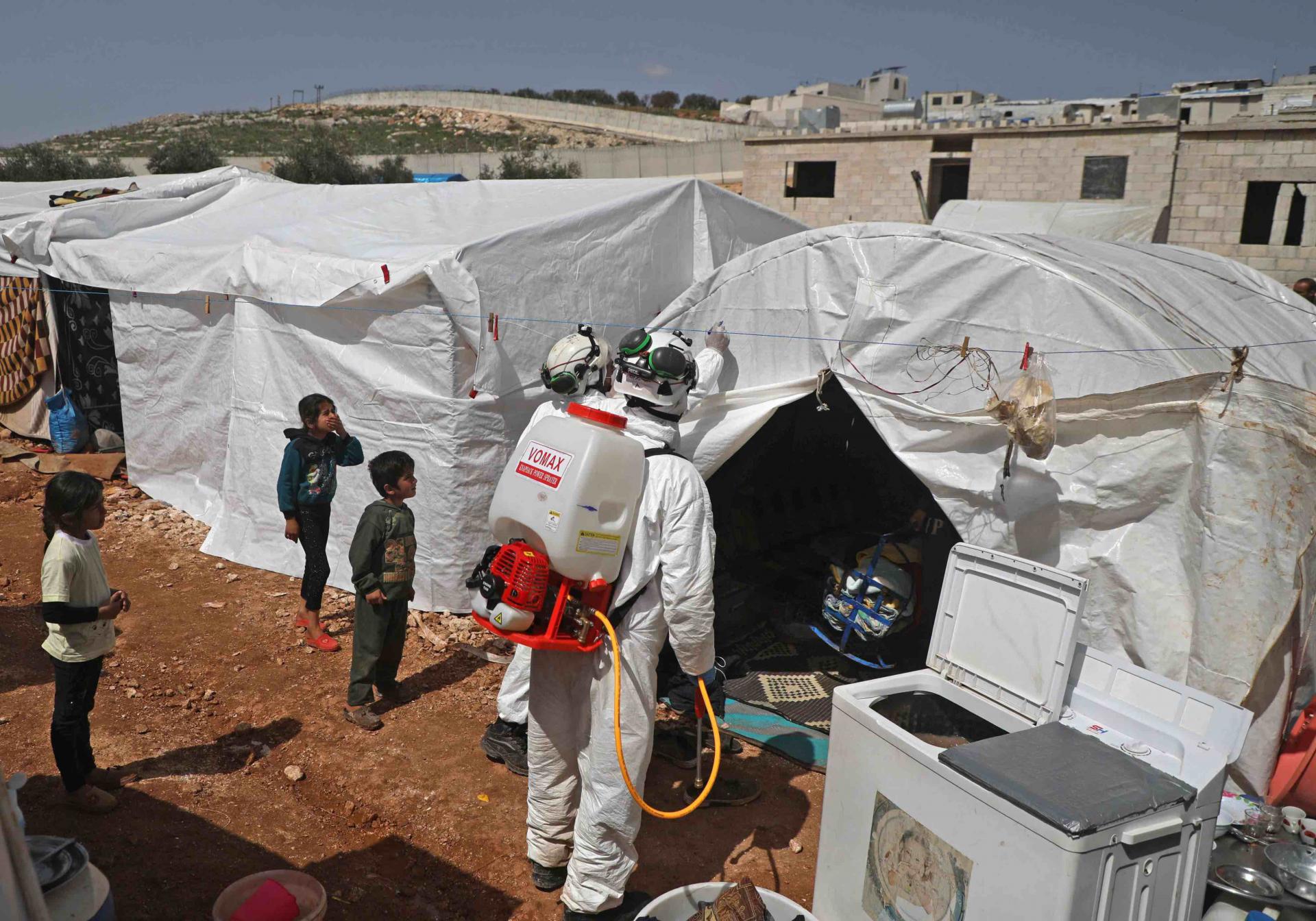 As part of the effort to prevent the worst in the rebel-held Idlib region, a doctor is visiting Yassin's camp in Kafr Lusin to raise awareness