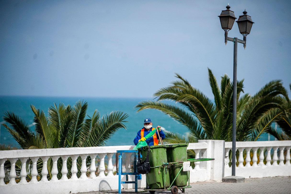 A garbage collector pictured wearing a mask in Tunis