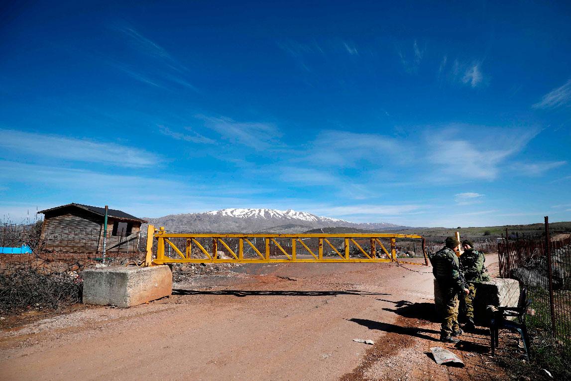 Israeli forces block a road leading to the Syrian border in the Israeli-occupied Golan Heights