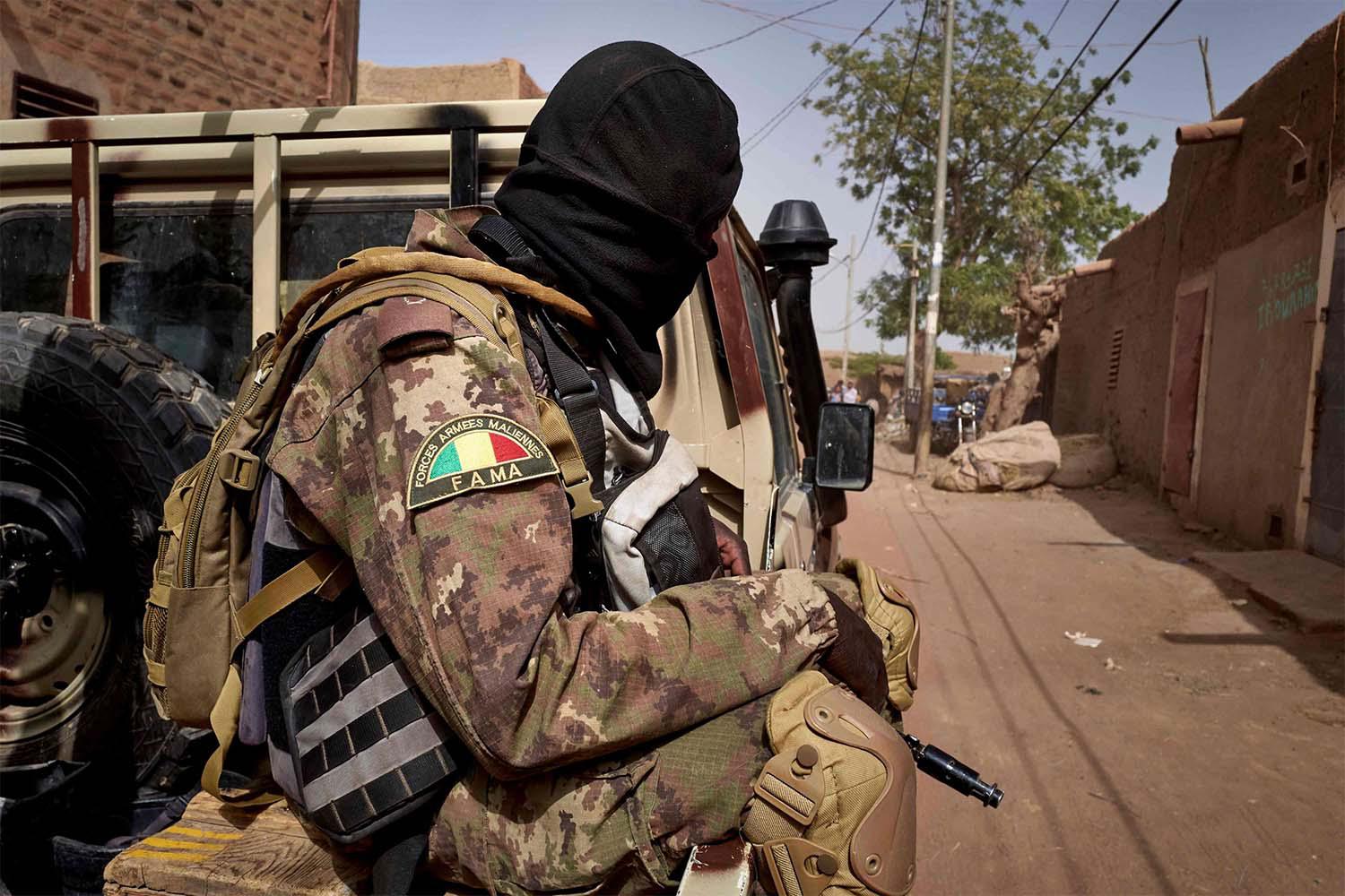 A soldier of the Malian army is seen during a patrol on the road between Mopti and Djenne, in central Mali