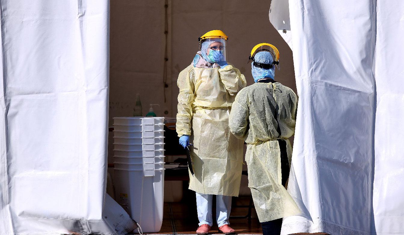 Germans pictured wearing medical suits to protect against the coronavirus