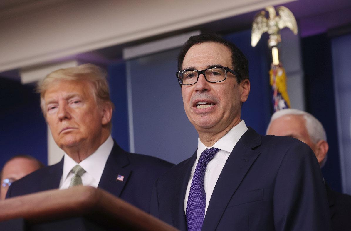 US President Donald Trump and Treasury Secretary Steven Mnuchin attend a press briefing at the White House