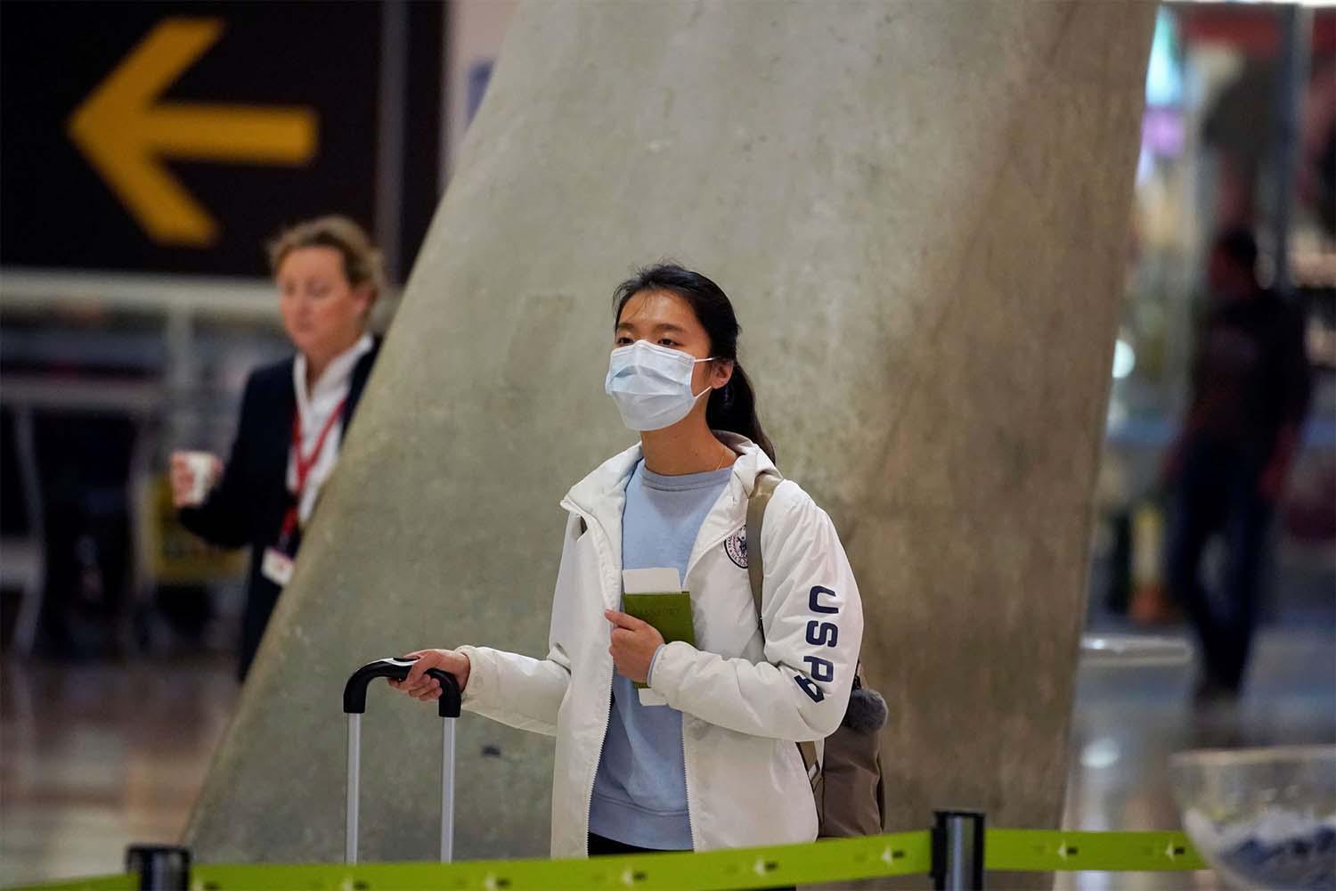  passenger, wearing a protective mask at Madrid's Adolfo Suarez Barajas Airport