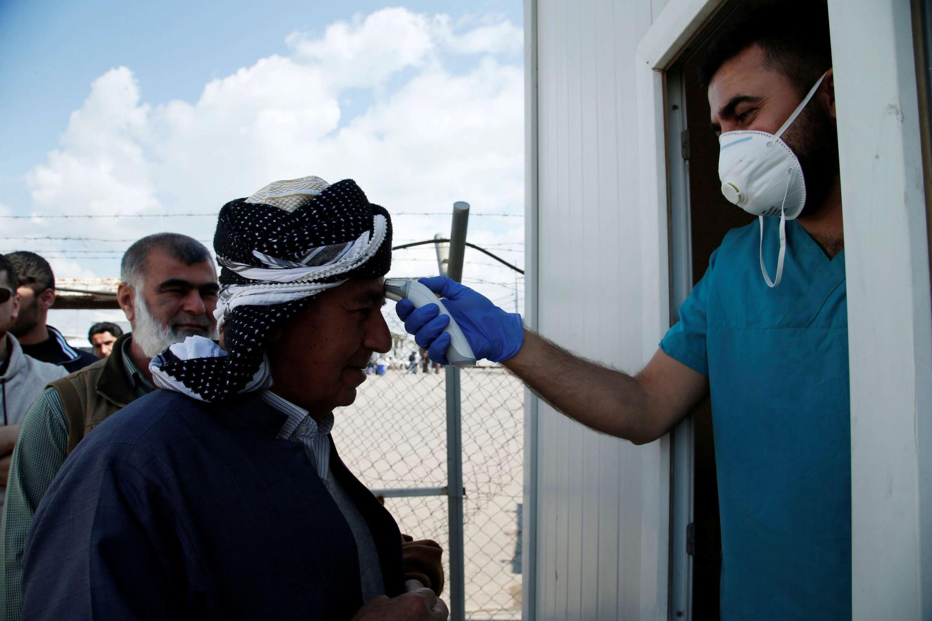 Iraqi authorities have closed land borders with Iran and banned the entry of foreign nationals travelling from there
