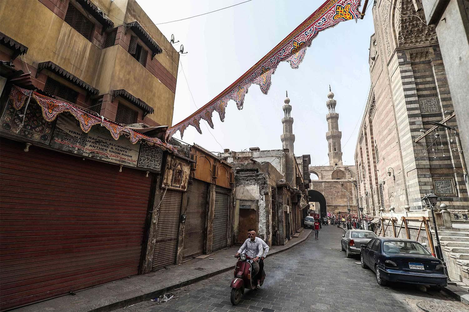  View of the area around Bab Zuweila (background), one of the remaining gates in the walls of the old medieval city of Egypt's capital Cairo