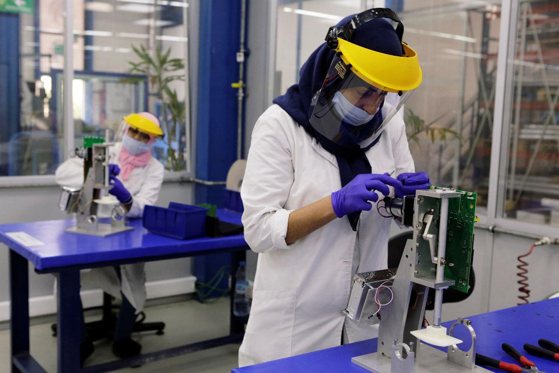 Employees work on a Moroccan ventilator at a factory in Casablanca