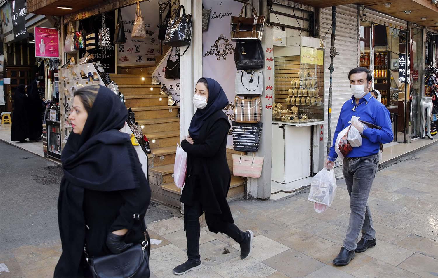Iranians wearing protective face masks in Tehran