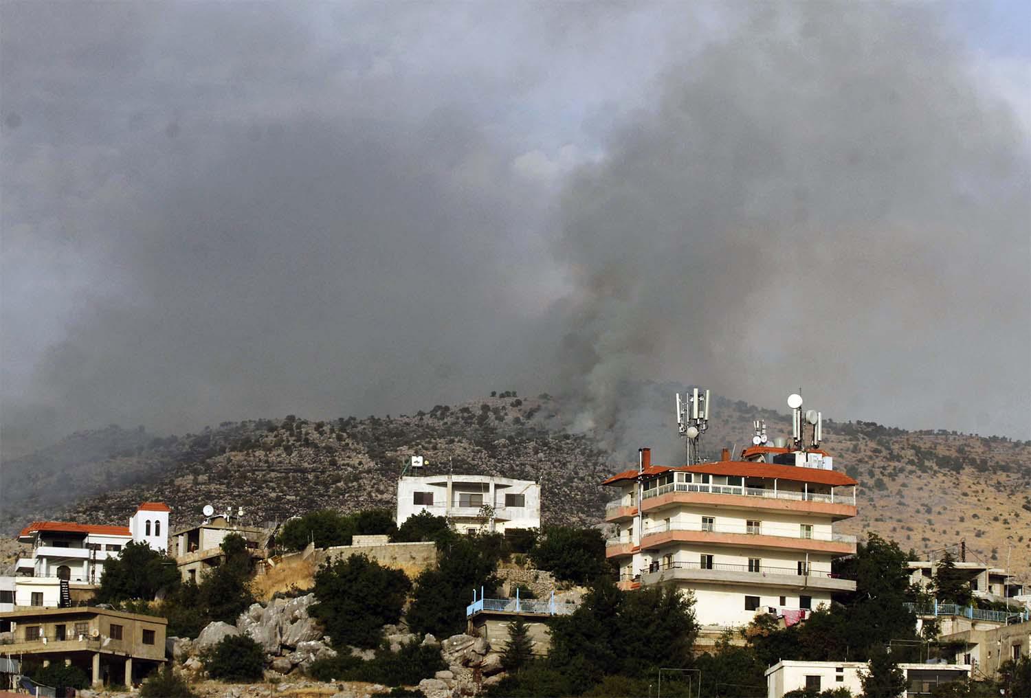 Smoke billows above the edges of southern Lebanon's Kfarchouba village after reported Israeli bombardment of the Shebaa Farms 