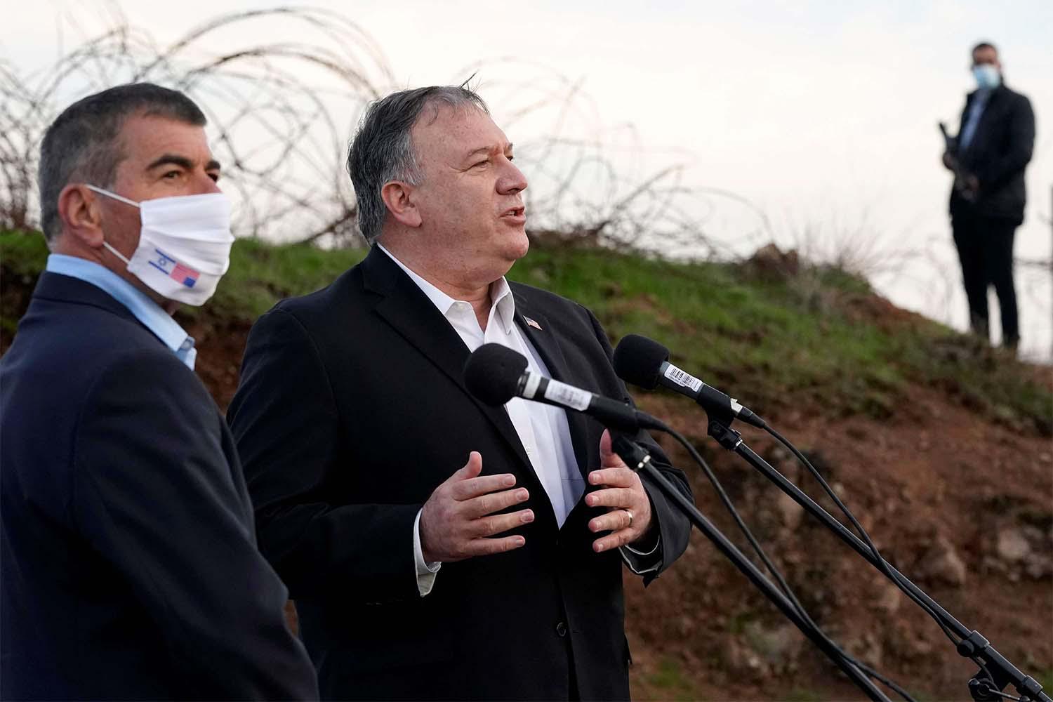 US Secretary of State Mike Pompeo speaks alongside Israeli Foreign Minister Gabi Ashkenazi (L) following a security briefing on Mount Bental