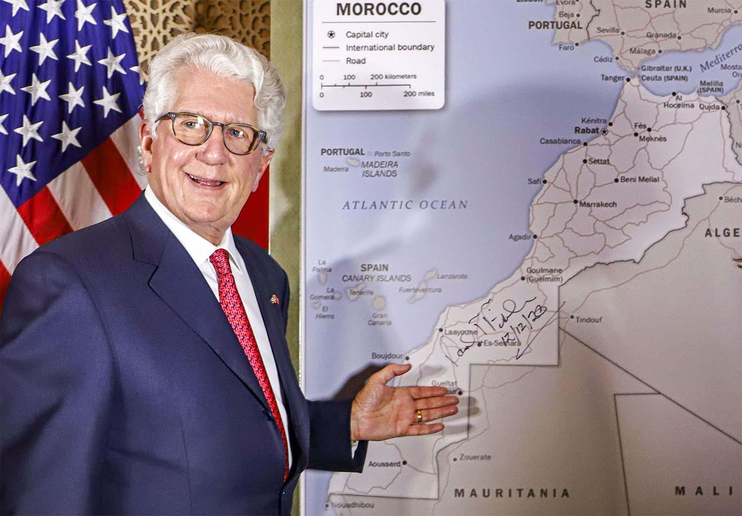 David T. Fischer, US Ambassador to Morocco, stands before a US State Department-authorised map of Morocco recognising the Western Sahara as a part of the North African kingdom