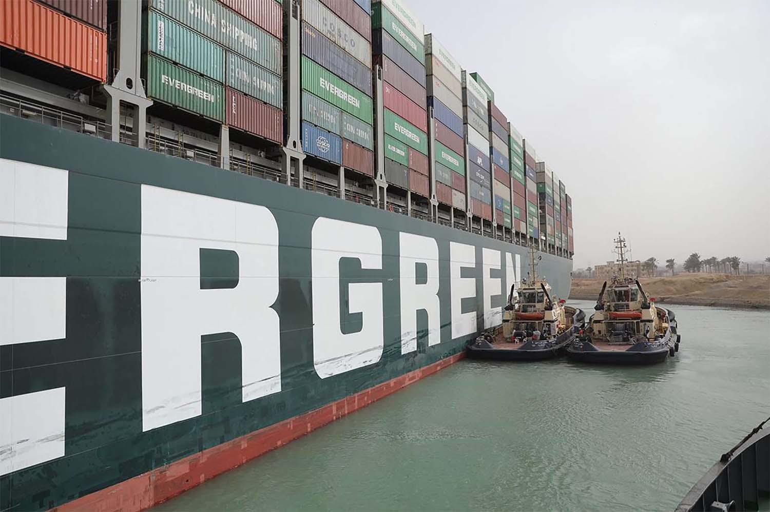 Eight tugs are working to move the giant vessel