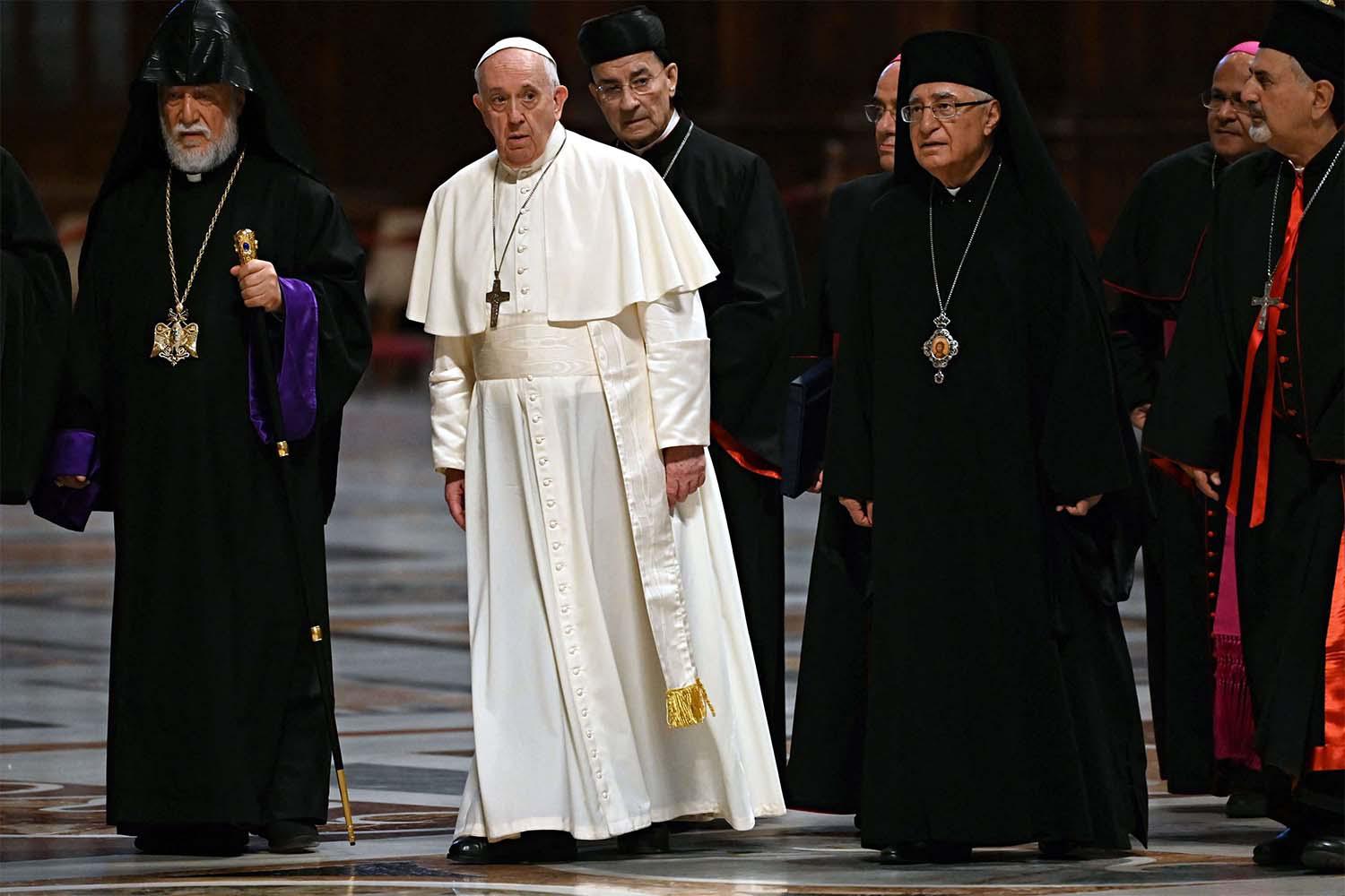 Pope Francis (C) with Lebanon's Christian leaders during a "Short Moment of Prayer, Day of Reflection and Prayer Lebanon" at the Altar of Confession in Saint Peter Basilica in the Vatican
