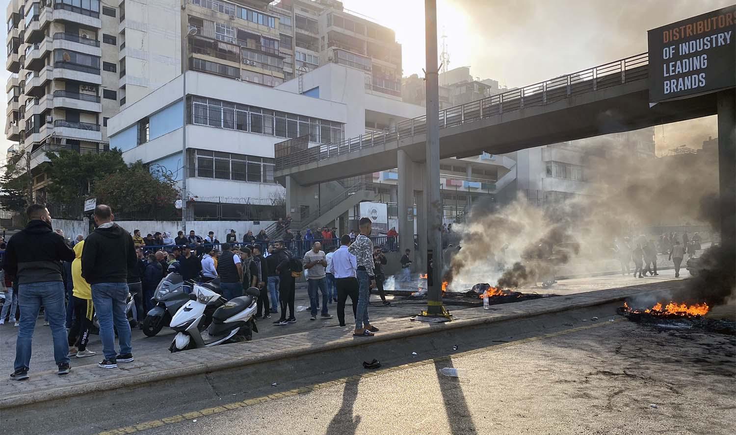 Roads were blocked by burning tyres in central Beirut, Tripoli and Sidon