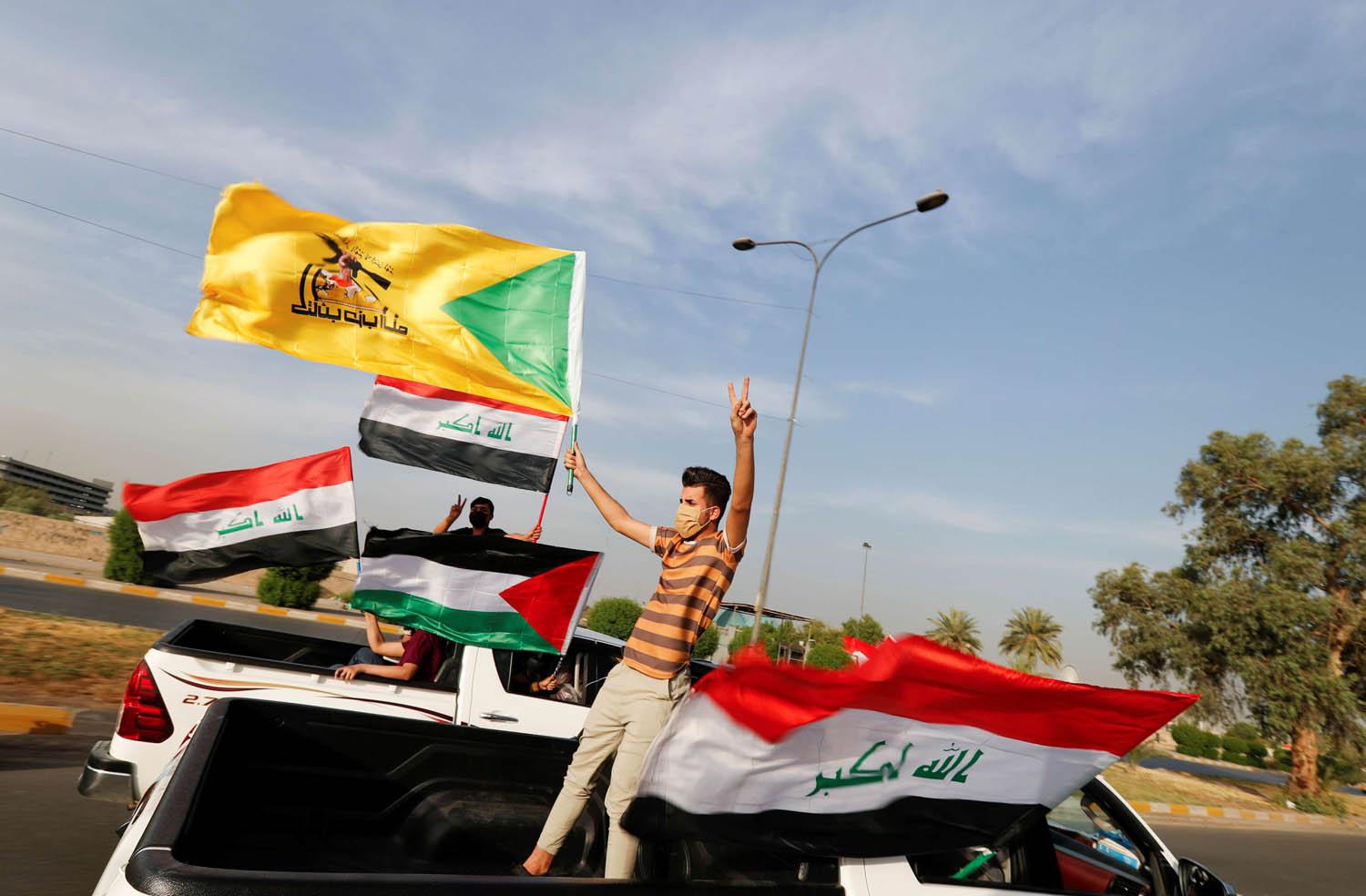 ناشطون في حزب الله العراقي يستعرضون وسط بغداد