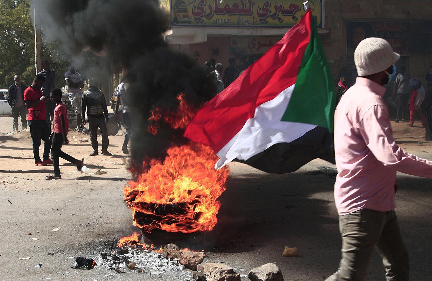 Protesters brave tear gas to demonstrate against military rule 