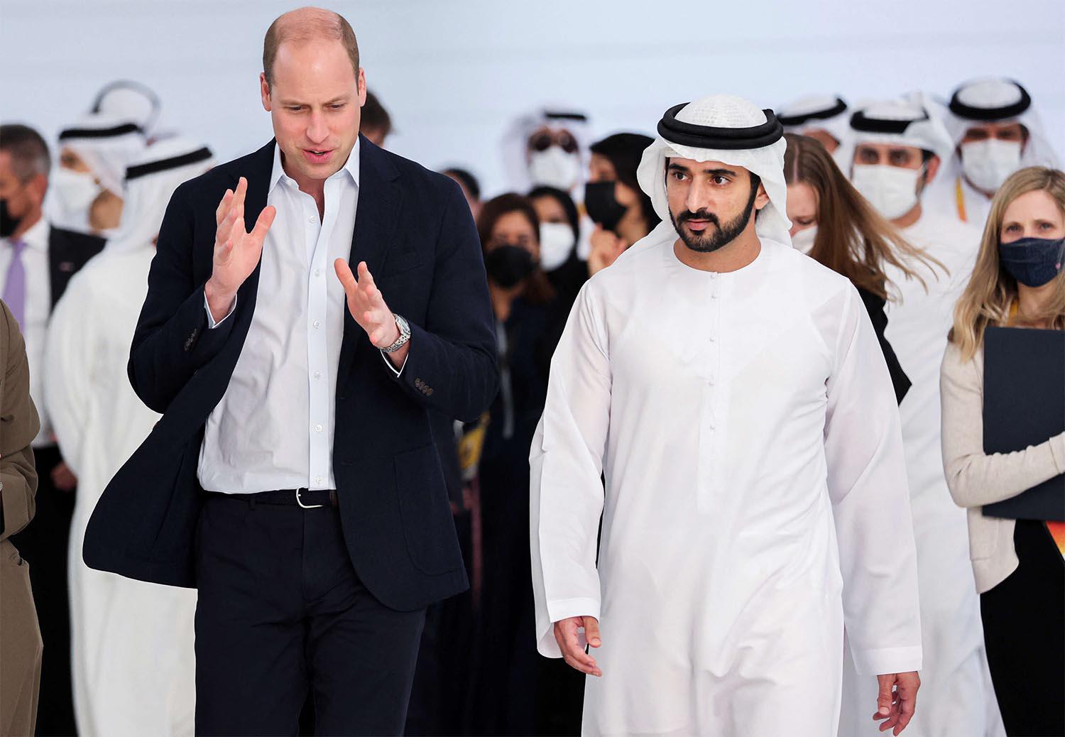 Prince William and Dubai's Crown Prince Sheikh Hamdan bin Mohammed bin Rashid Al Maktoum walk during a tour at the Expo 2020 in Dubai