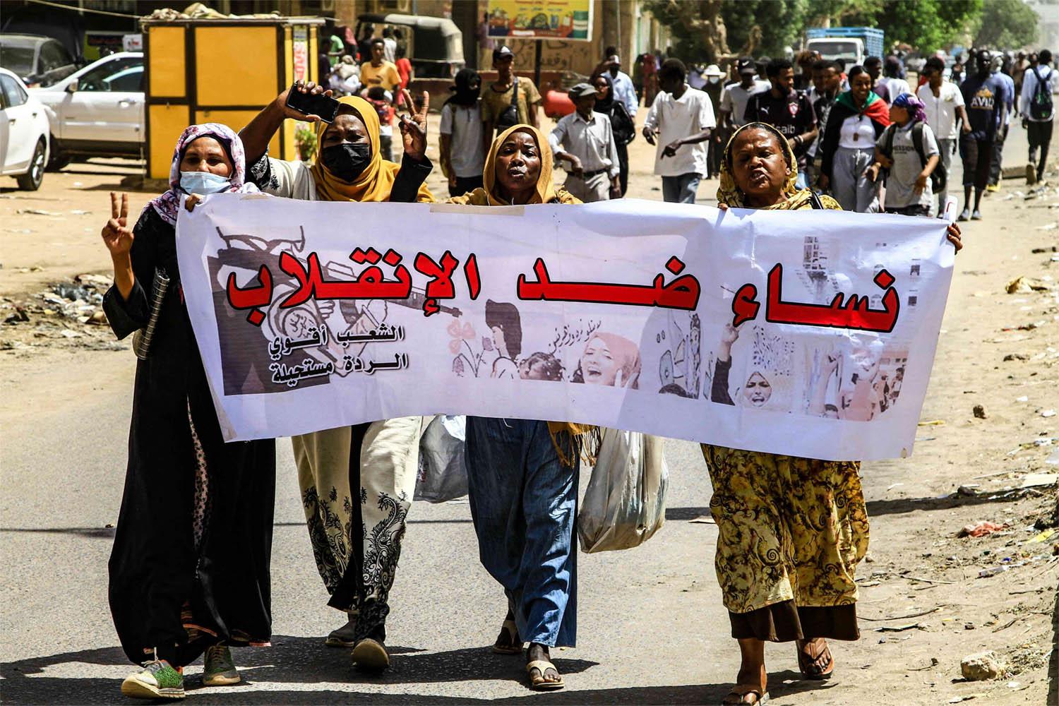 Women against the military coup, reads the banner